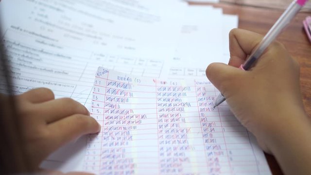 Educational researchers checking statistical in document, questionnaires about education and teaching. As well as satisfaction of students or customers in office.
