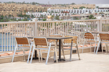 Table and chairs in beach cafe next to the red sea in Sharm el Sheikh, Egypt
