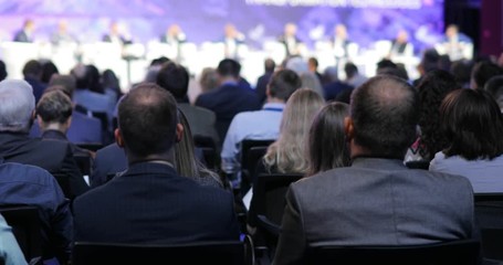 Political discussion on forum. Briefing with viewers and journalists. International business and political summit in audience. Symposium with heads of states. Educational science conference.