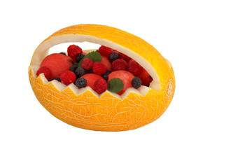 the basket is made of melon and filled with different fruits
