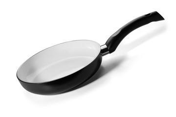 Black pan with white ceramic coating on a white background