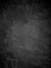 black textured background in stone or rock wall grunge design, old distressed vintage background in dark monochrome colors