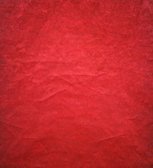 Red background paper with ripped distressed old grunge texture in elegant vintage design