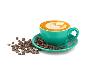 Side view of hot latte coffee with latte art and roasted coffee beans in a green cup isolated on white background.