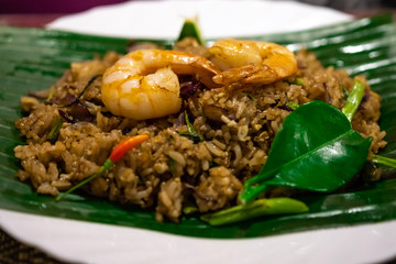 A plate of national Thai dish with Pad Ki Mao-Drunken Noodles closeup on the table.