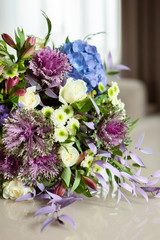  Beautiful flowers in a warm and comfortable interior, a bouquet of flowers on the surface, on the table.