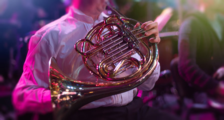 man playing a horn