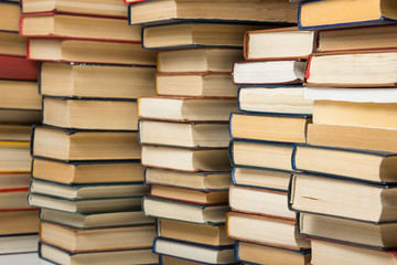 Stack of books background. many books piles.