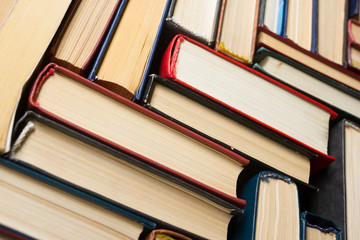 Stack of books background. many books piles.