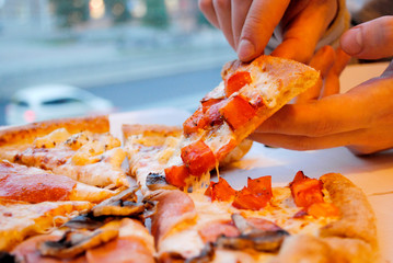 tear off a slice of pizza