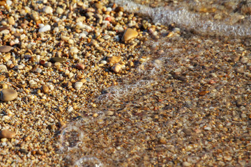 sea pebbles colored granite on the beach