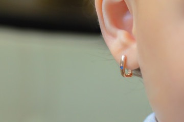 the puncture of ears to children is younger than three years