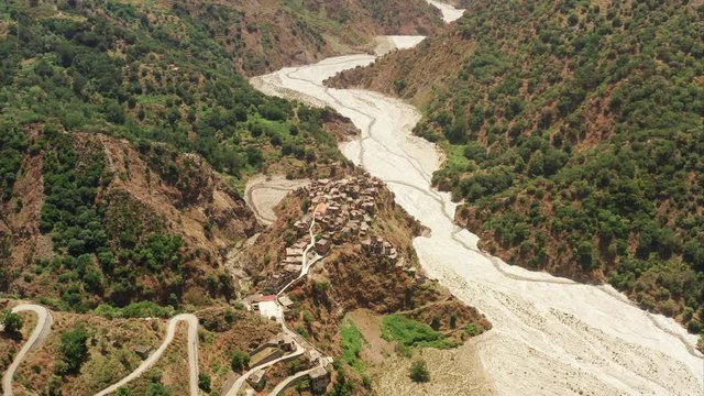 Roghudi Vecchio fascinating Italian ghost town located in Aspromonte mountains in Southern Italy. It was abandoned in 1973 after a series of natural disasters (flood). Travel destination. Aerial Shot.