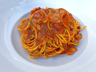 spagetti all'Amatriciana, gourmet pasta plate top view close up
