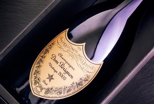 Tambov, Russian Federation - August 14, 2018 Close-up of Bottle of Champagne Dom Perignon Vintage 2005 in box. Black background.