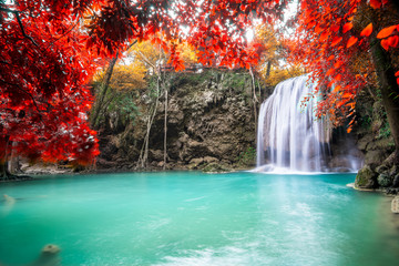Amazing in nature, beautiful waterfall at colorful autumn forest in fall season