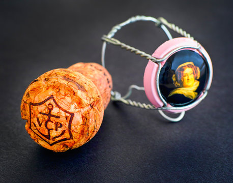 Tambov, Russian Federation - February 22, 2018 Veuve Clicquot Champagne cork and muselet with cap. Black background.
