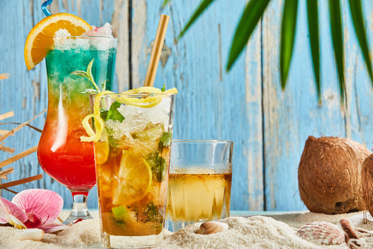Summer drinks cocktails on beach sand