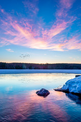 sunrise over frozen lake