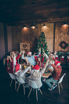 Vertical View Of Nice Lovely Cheerful Cheery Positive Big Full Family Couples Brother Sister Wearing Cap Hat Headwear Having Fun Eve Noel In Loft Industrial Style Interior House Indoors