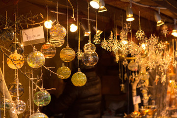 Christmas souvenirs on the counter in Europe, Painted glass Christmas balls with fairy tales.