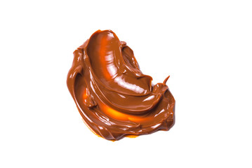 Melted tasty caramel splashes isolated on white background.
