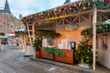 Fototapeta na wymiar Pavilions offering mulled wine at traditional Christmas market on
