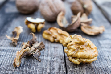 Walnuts kernels on a rustic old wooden table. Fresh walnuts.
