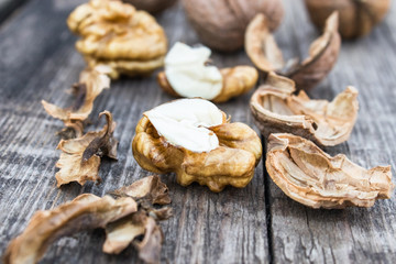 Walnuts kernels on a rustic old wooden table. Fresh walnuts.