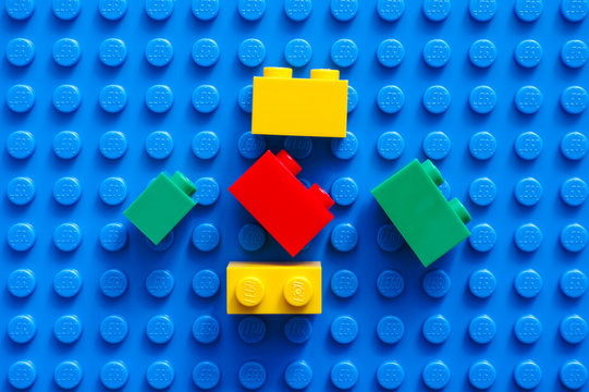 Tambov, Russian Federation - February 20, 2015 Five Lego blocks on blue baseplate. Studio shot.