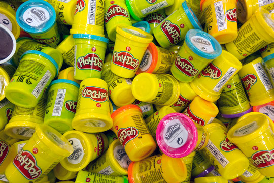 Paphos, Cyprus - October 18, 2016 Heap of Play-Doh containers with difrent color modeling compound. Play-Doh is manufactured by Hasbro.