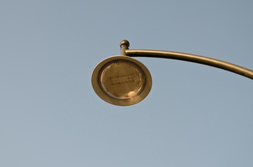 Silhouette of a street lamp at day