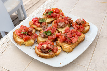 Appetizer of bruschetta with tuna