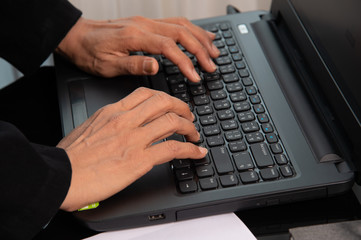 Closeup working woman hands typing on keyboard computer 