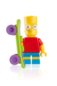 Tambov, Russian Federation - April 30, 2014 Lego Bart Simpson minifigure with skateboard on white background. Studio shot.