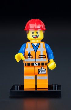 Tambov, Russian Federation - February 10, 2014 LEGO Hard Hat Emmet minifigure on black background. LEGO Movie series. Studio shot.