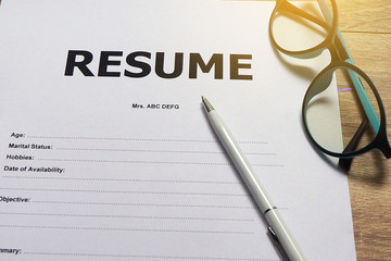 Job Application Form Have pens and glasses. Closeup of Resume