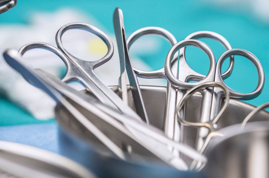 Some scissors for surgery on a tray, conceptual image, horizontal composition
