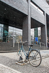 KRAKOW, POLAND - DECEMBER 12, 2018: Bike stand by the Jagiellonian University modern building