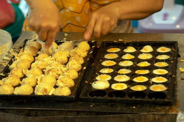 Eggs and other mysterious snacks in street market, Chiang Mai, Thailand