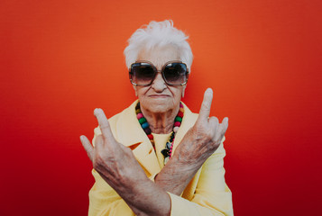 Funny grandmother portraits. Senior old woman dressing elegant for a special event. Rockstar granny...