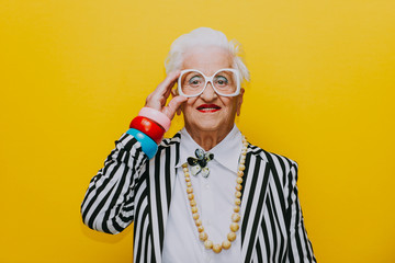 Funny grandmother portraits. Senior old woman dressing elegant for a special event. granny fashion...