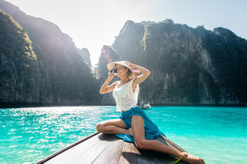 Beautiful woman making an excursion to phi phi island and maya beach in Thailand