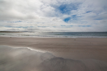 A sandy beach on the Hebridean island of North Uist, on a late summers day