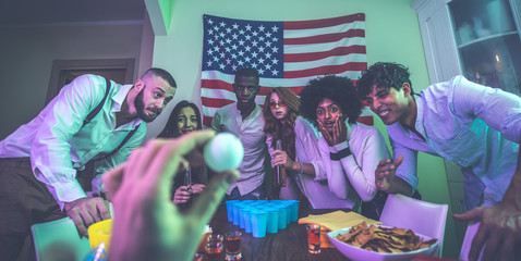 A group of young people celebrating and making party at home