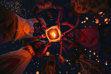 Group of friends making party on the beach at sunset time © oneinchpunch