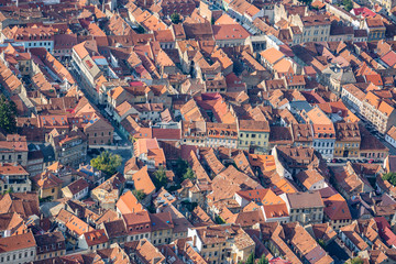 View of Brasov old buildings bricks rooftops in Romania