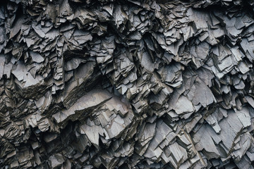 Basaltic rocks on the black sand beach - Powered by Adobe