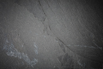 Naklejka premium Dark grey and black slate background or texture