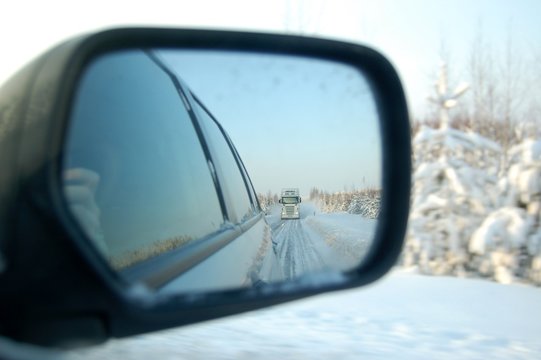 Reflection Of Truck In Back Wing Mirror At Winter Road Tractor Unit